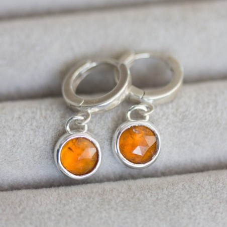 Huggie earrings with dangling orange kyanites in sterling silver