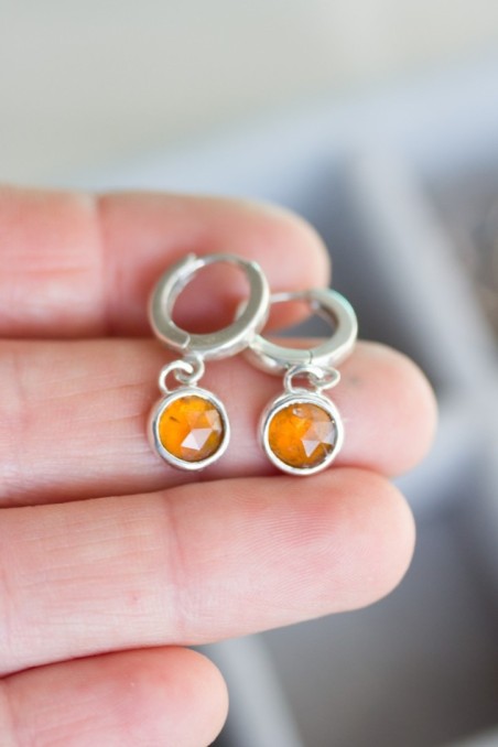 Huggie earrings with dangling orange kyanites in sterling silver