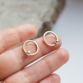 Modern circle stud earrings made of brass and silver