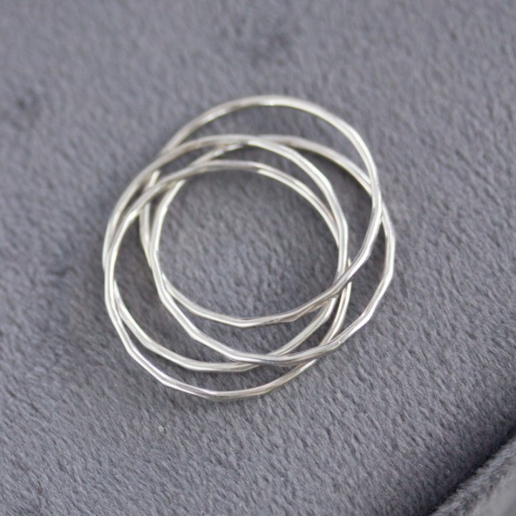 Interlocking ring made of 4 tiny bands, sterling silver or gold