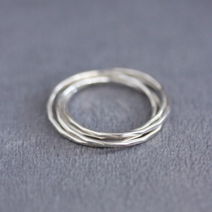 Interlocking ring made of 4 tiny bands, sterling silver or gold