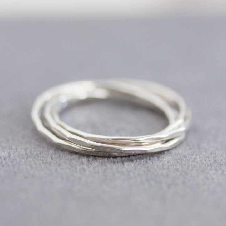 Interlocking ring made of 4 tiny bands, sterling silver or gold