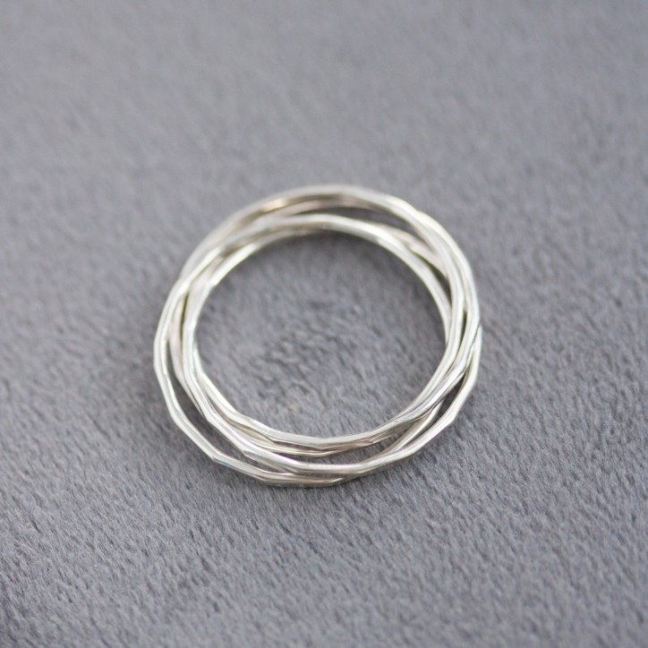 Interlocking ring made of 4 tiny bands, sterling silver or gold