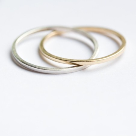 Interlocked rings made of sterling silver and 9k gold