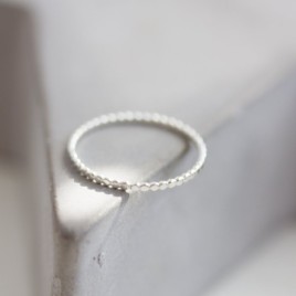Flattened beaded ring