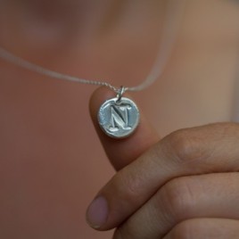 Initial necklace with a typewriter font initial, fine silver, uppercase