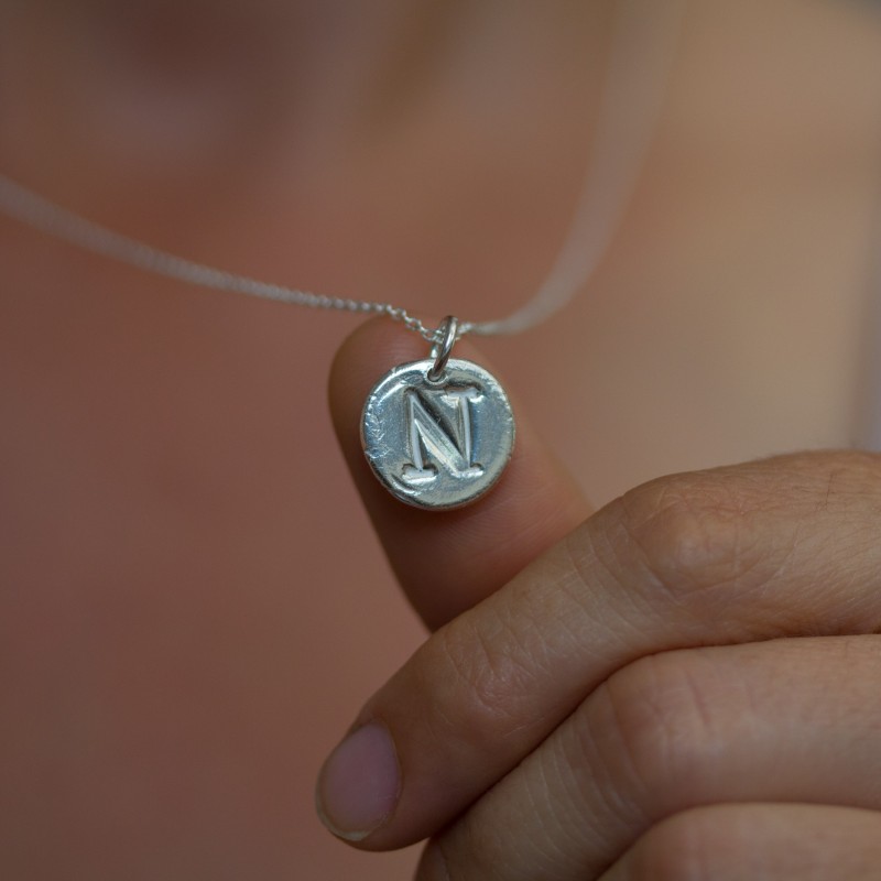 Initial necklace with a typewriter font initial, fine silver, uppercase