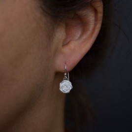 Nature inspired dangle earrings with silver roses