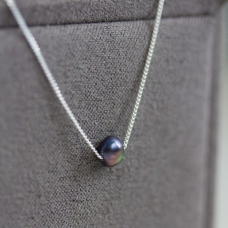 Sterling silver necklace with a dark blue keshi pearl bead