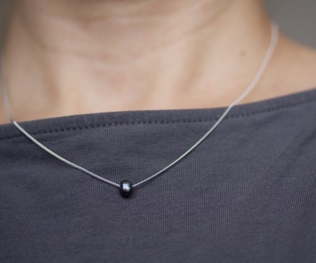 Sterling silver necklace with a dark blue keshi pearl bead