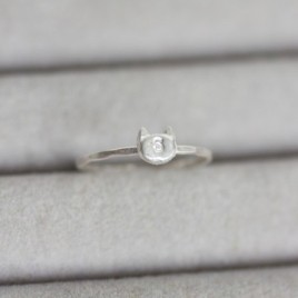 Initial ring with hand stamping in a cat head shape