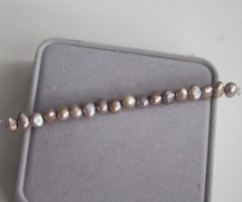 Sterling silver necklace with a pink-grey pearl bead